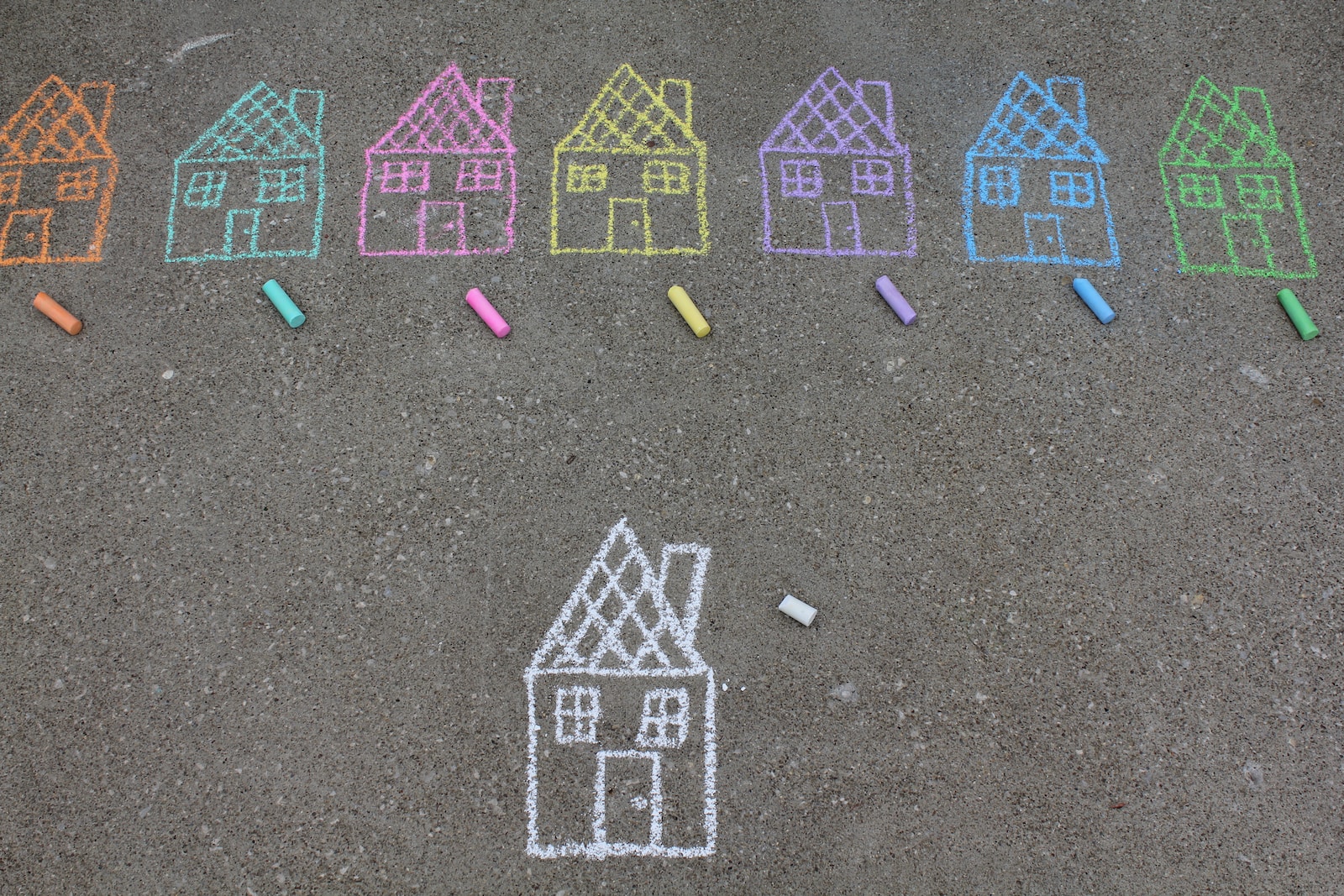 assorted-color house illustration on gray concrete surface