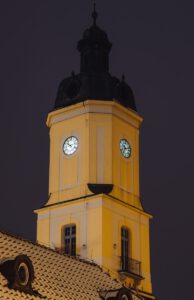 brown concrete building with clock