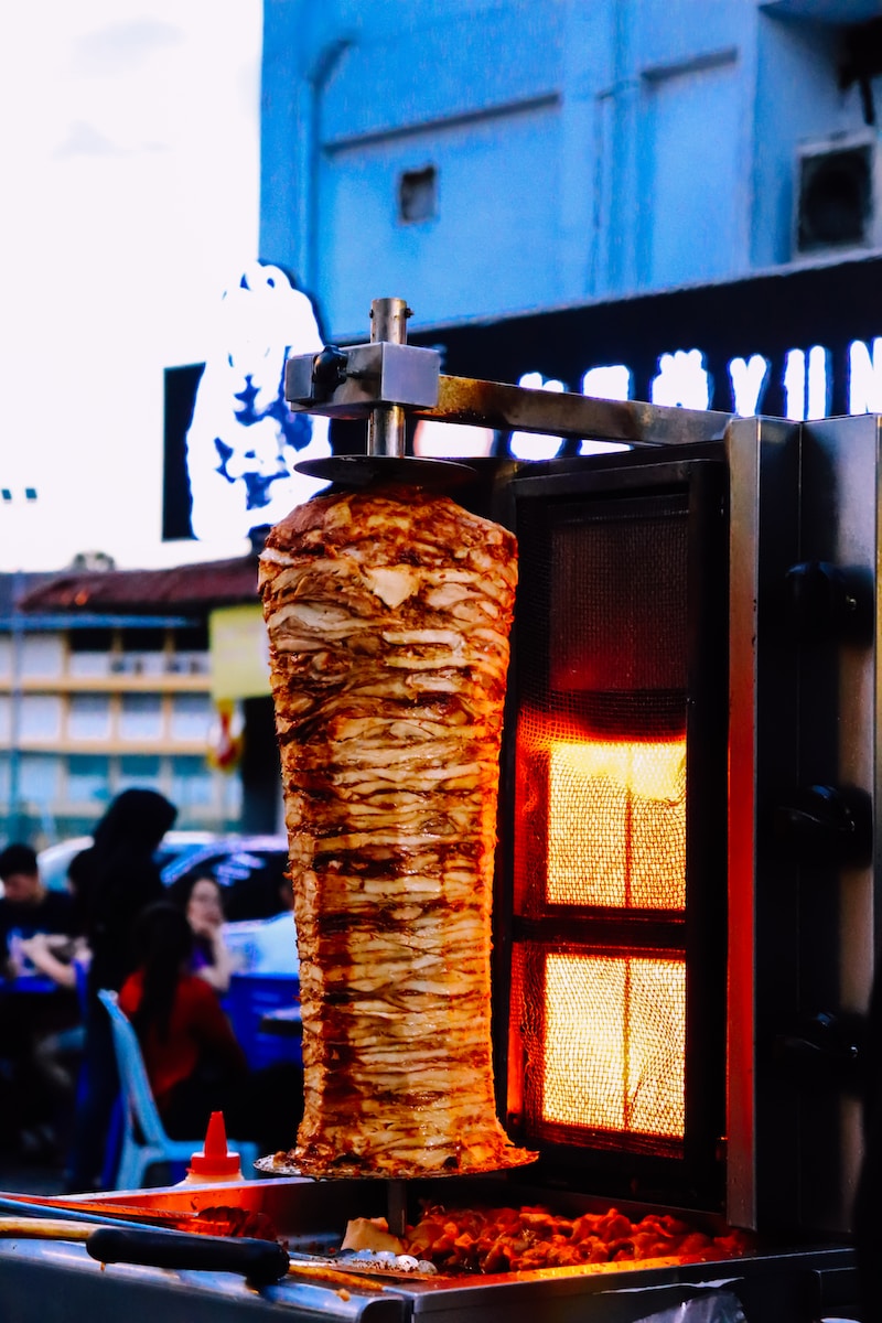 brown wooden post with fire during daytime