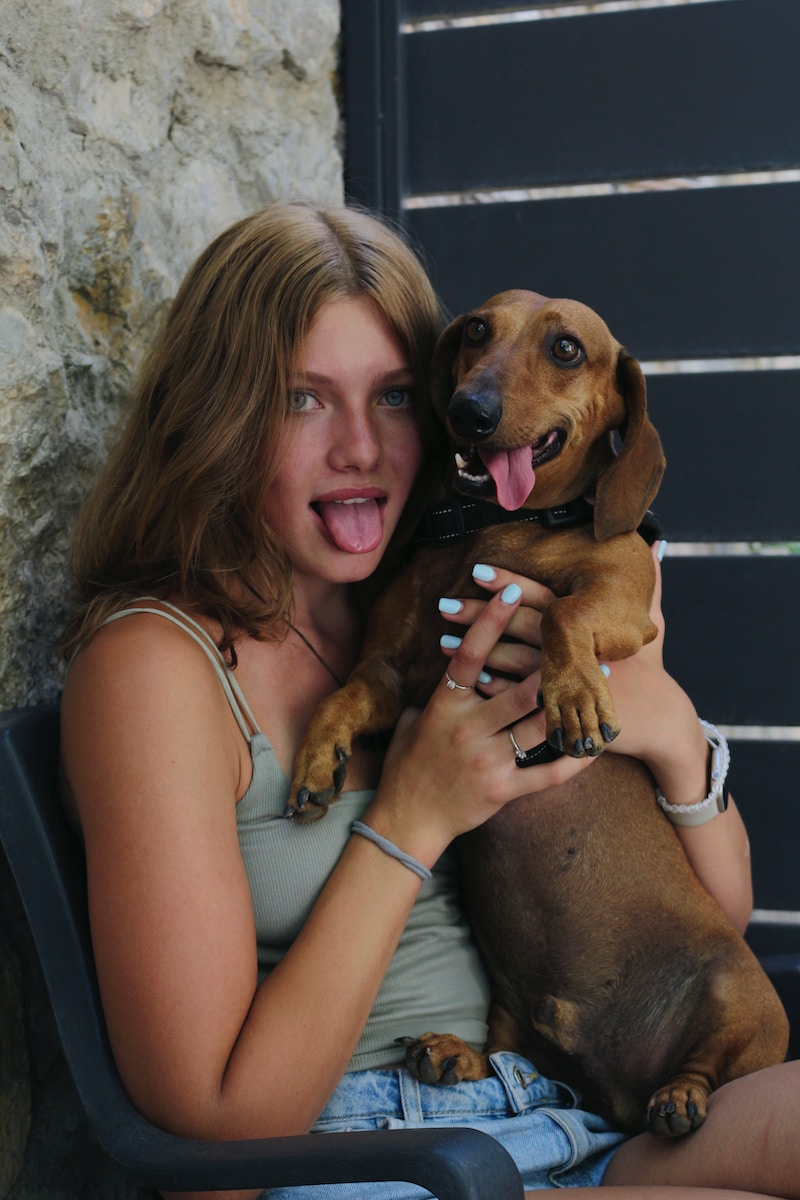 a woman holding a dog